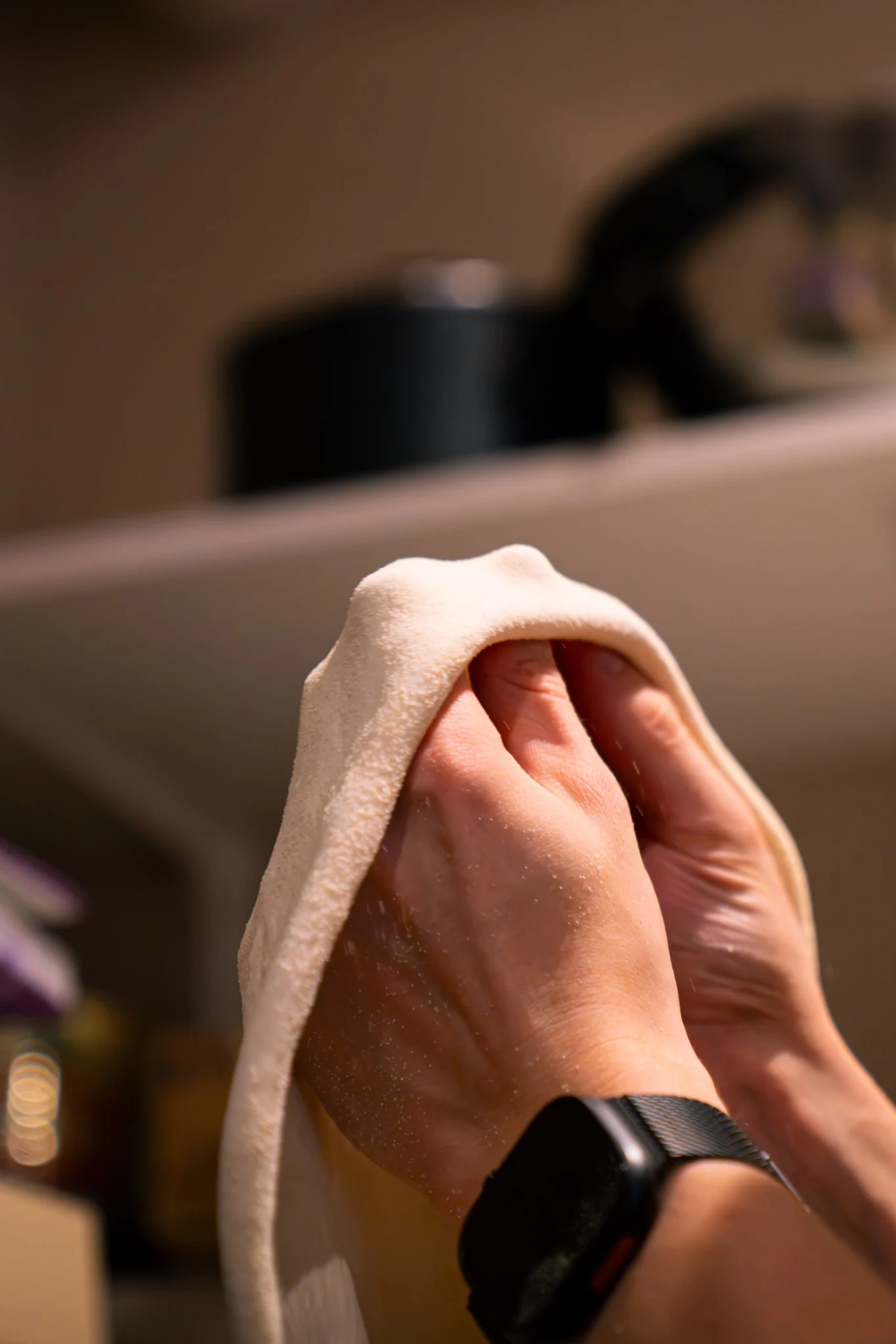 Hands stretching fresh sourdough pizza dough at Billy’s Pizza