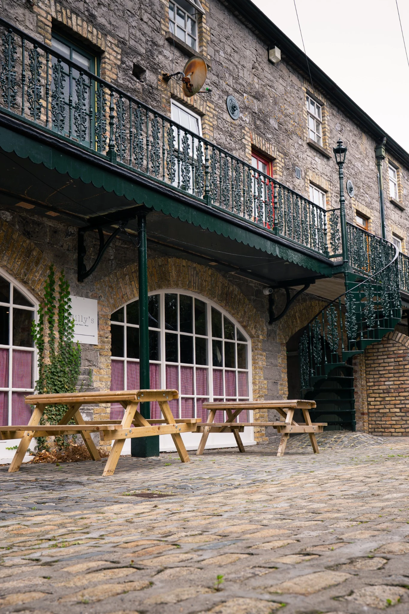 Billy’s Pizza courtyard and stone exterior in Ballina, Ireland