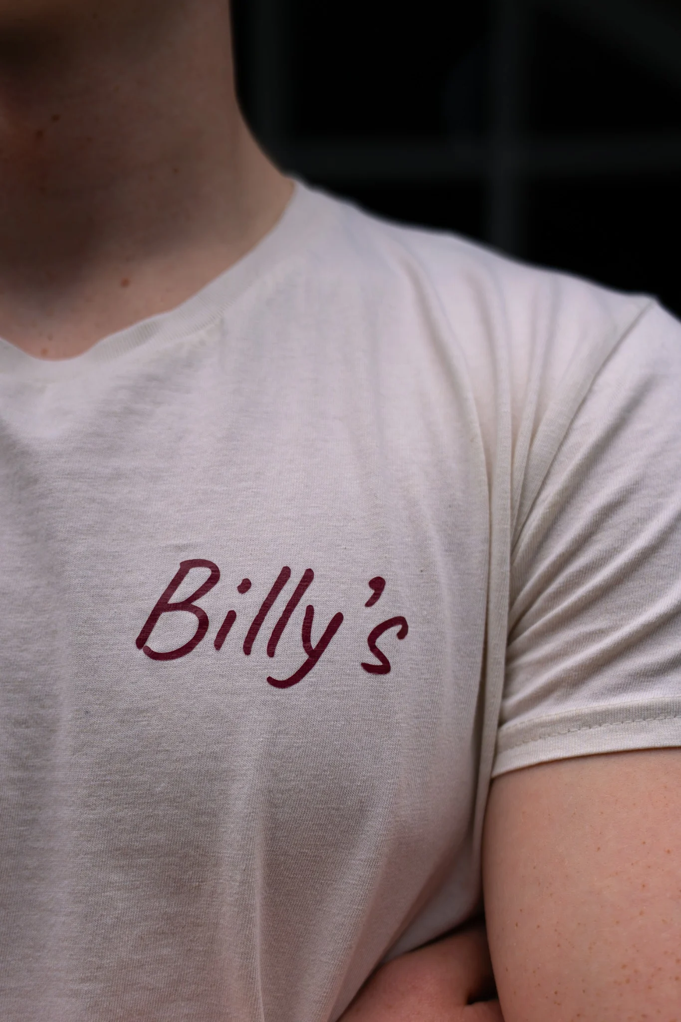 Billy’s Pizza branded staff shirt detail
