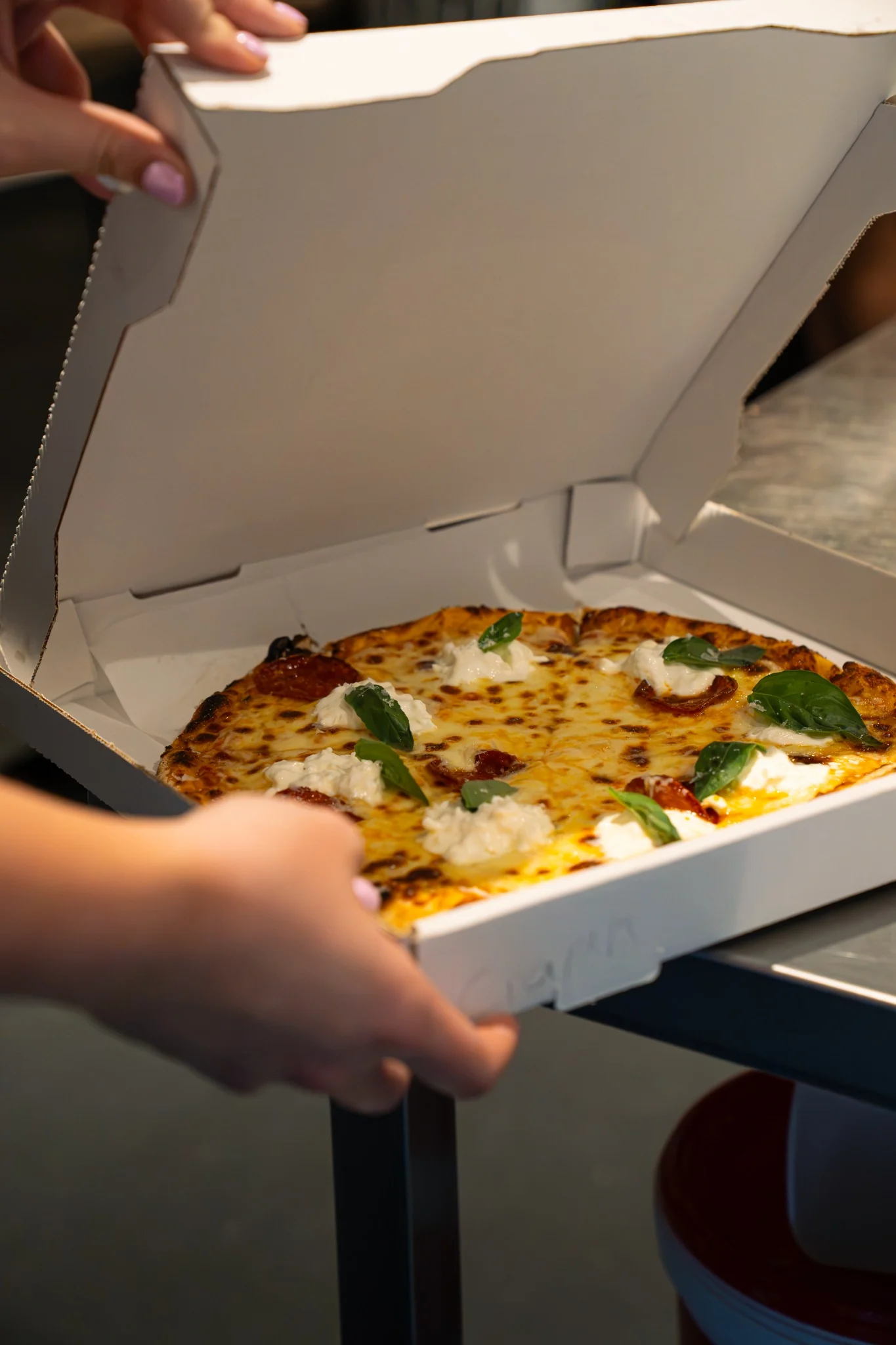 Fresh Billy’s Pizza being presented in a takeaway box