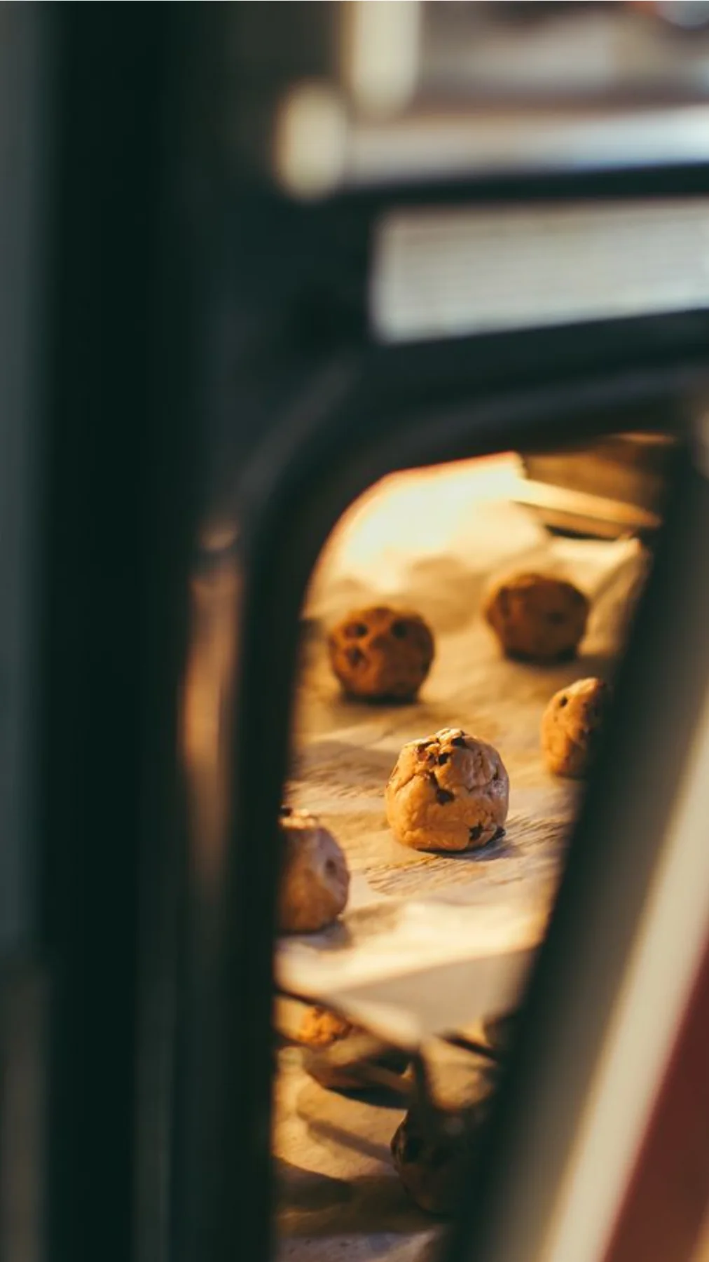 Cookies baking inside a warm oven