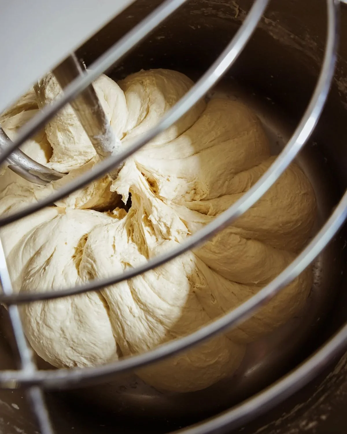 Bread dough mixing in a professional bakery mixer
