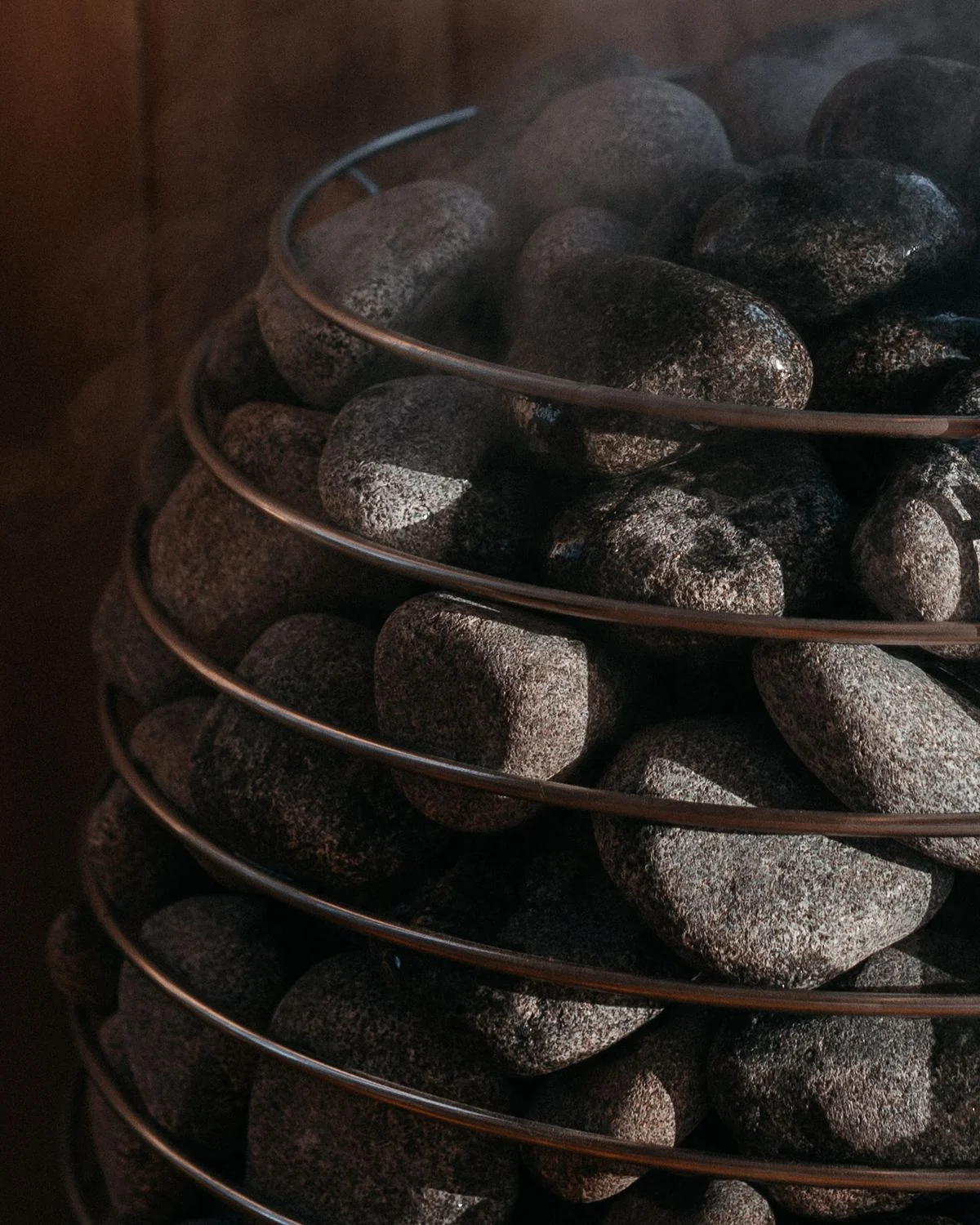 Close detail of hot sauna stones in a wellness space
