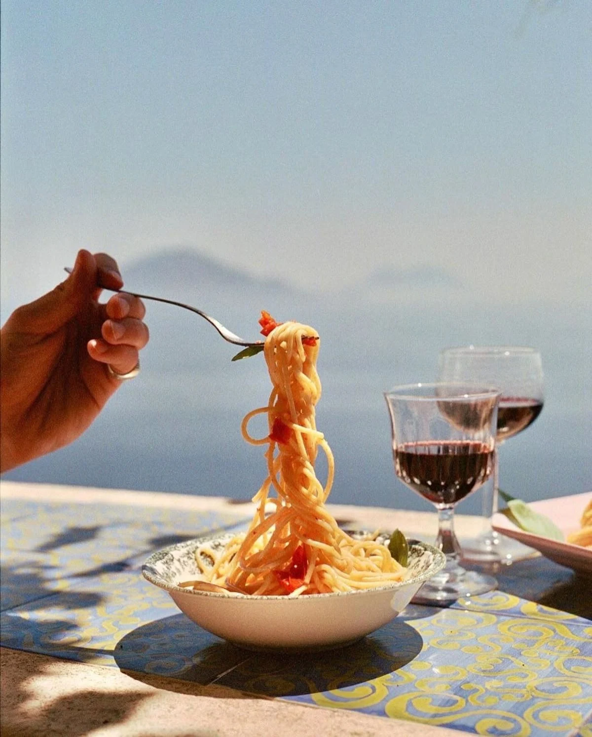Pasta and wine served by the sea on Isola di San Pietro in Sardinia