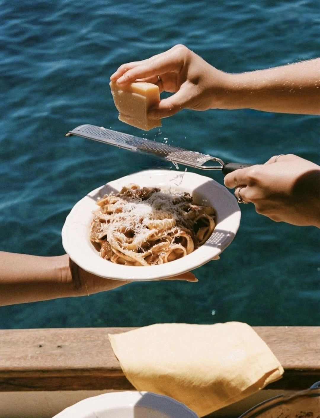 Fresh pasta finished with cheese beside the sea on Isola di San Pietro in Sardinia