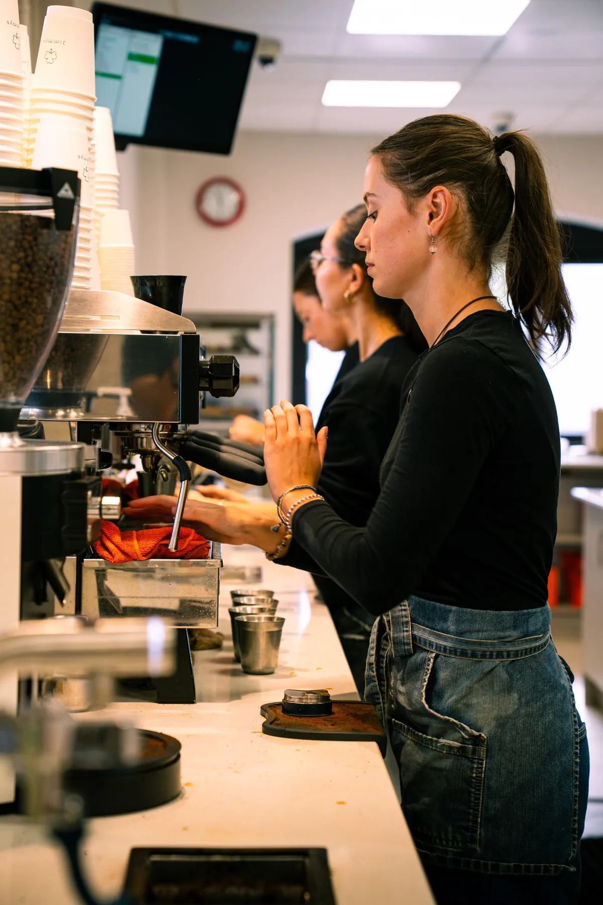 Barista working at the espresso machine inside Jimmys Ballina