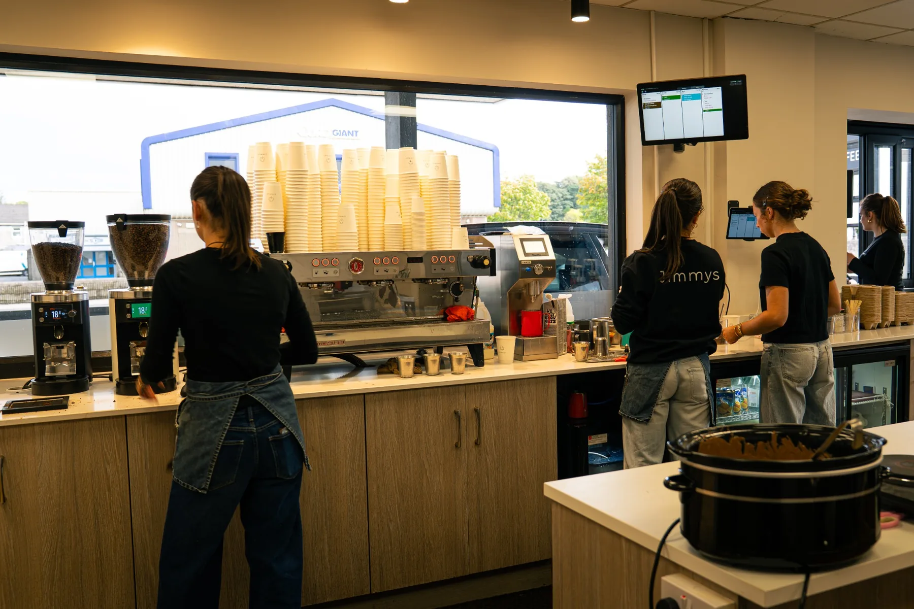 Jimmys team working together behind the coffee bar in Ballina