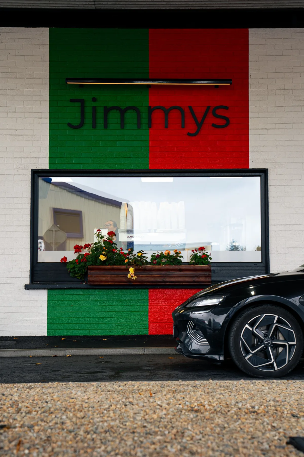 Jimmys green and red facade branding in Ballina