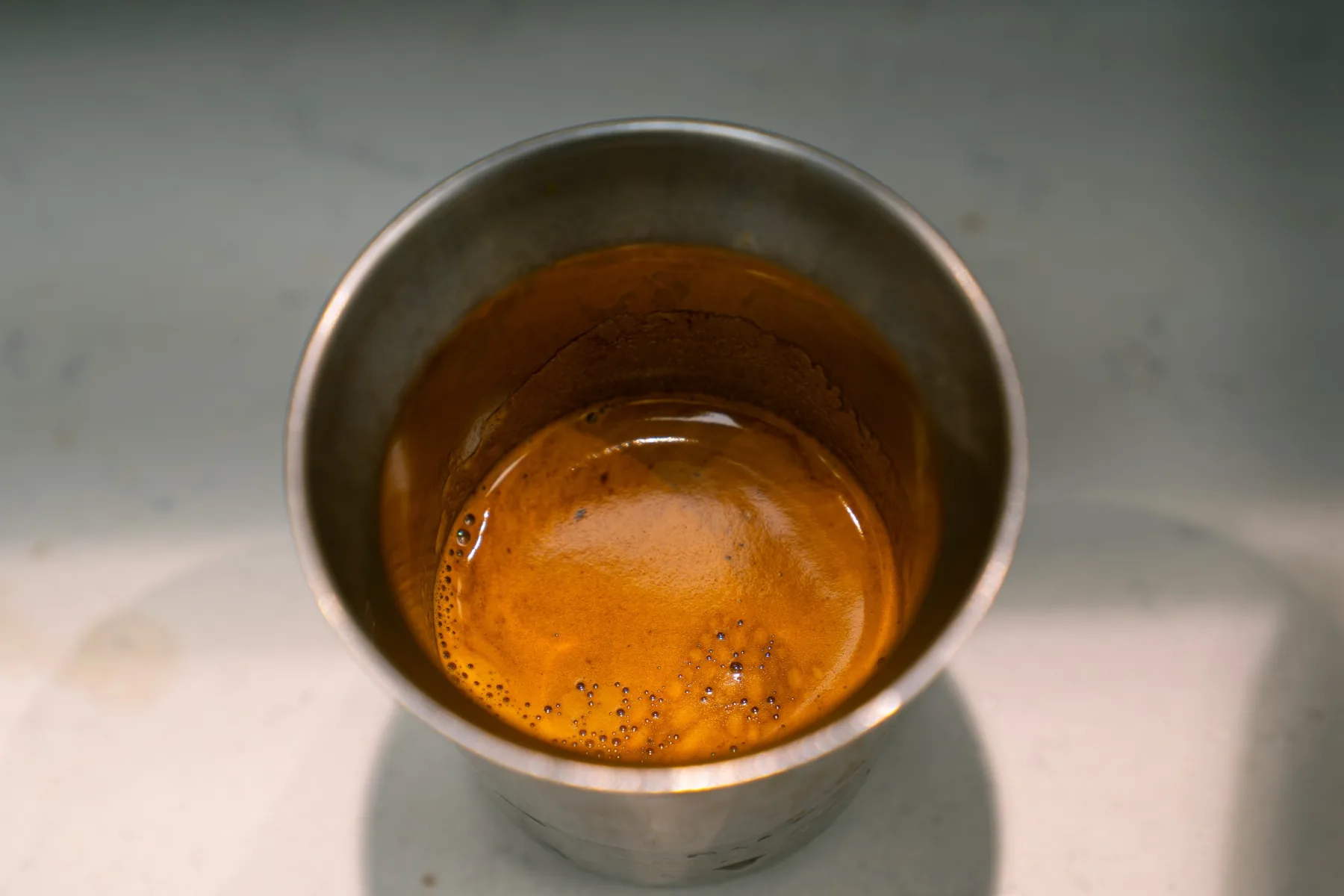 Fresh espresso in a metal cup at the Jimmys coffee bar