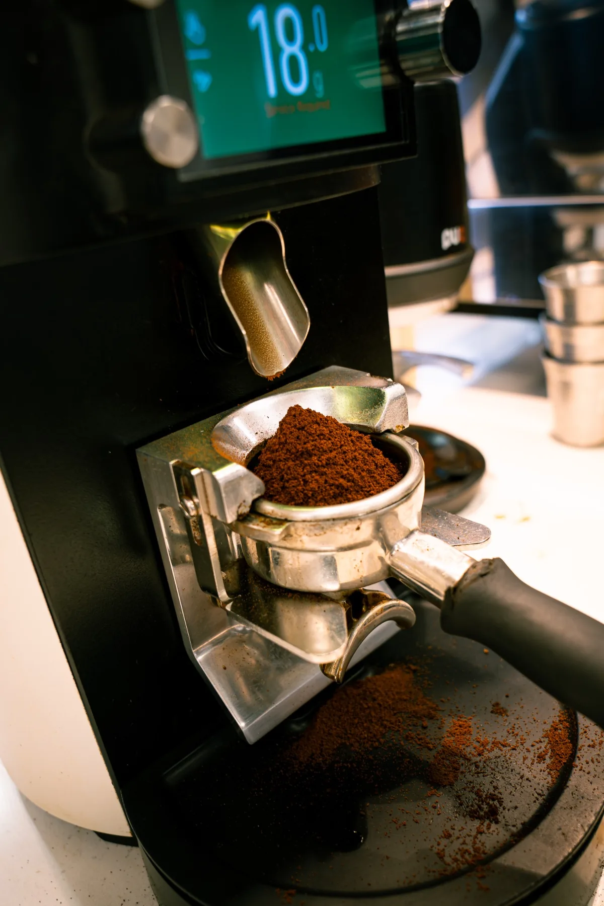 Freshly ground coffee in a portafilter at Jimmys