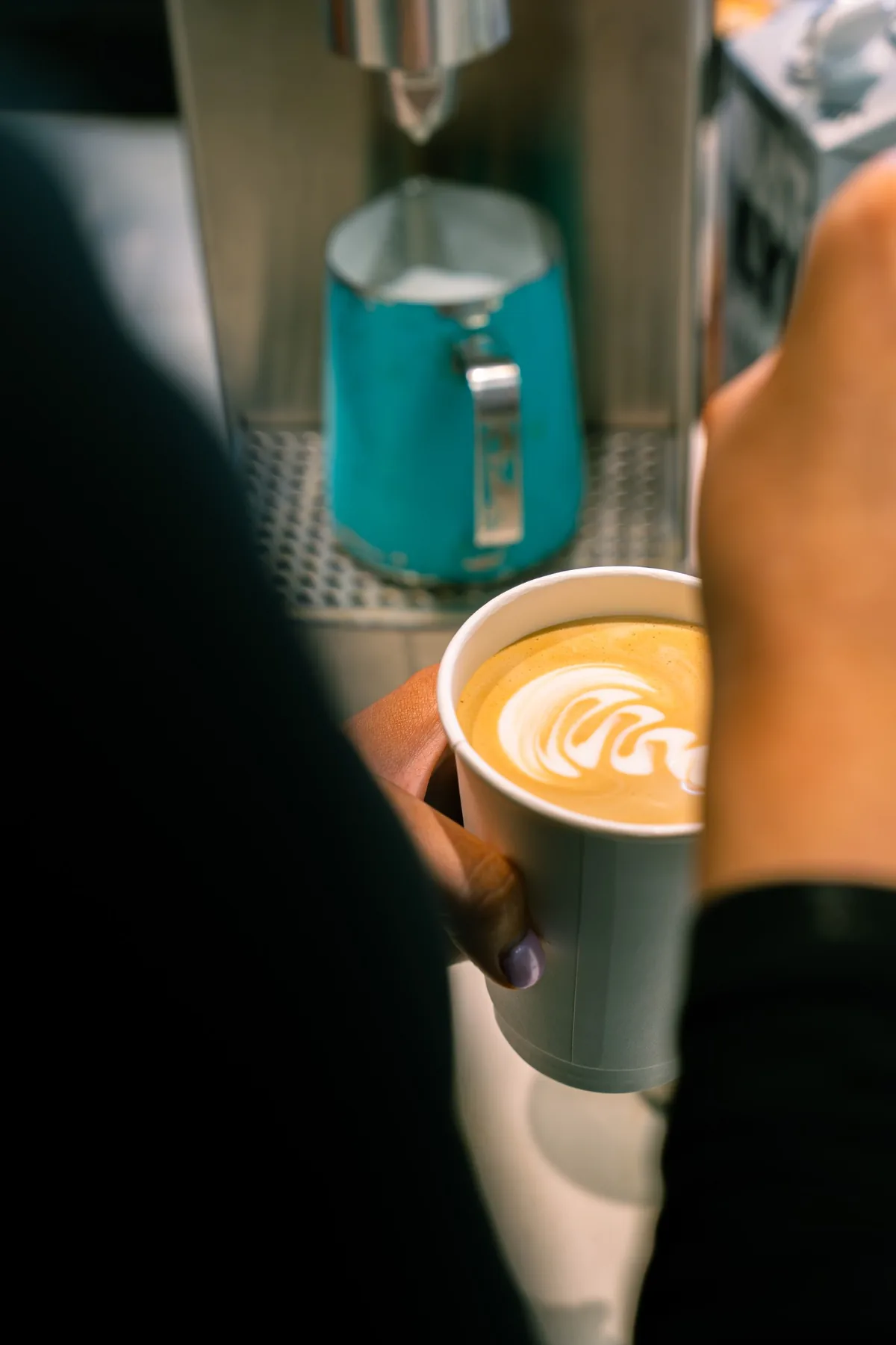 Fresh latte being prepared at the Jimmys coffee machine