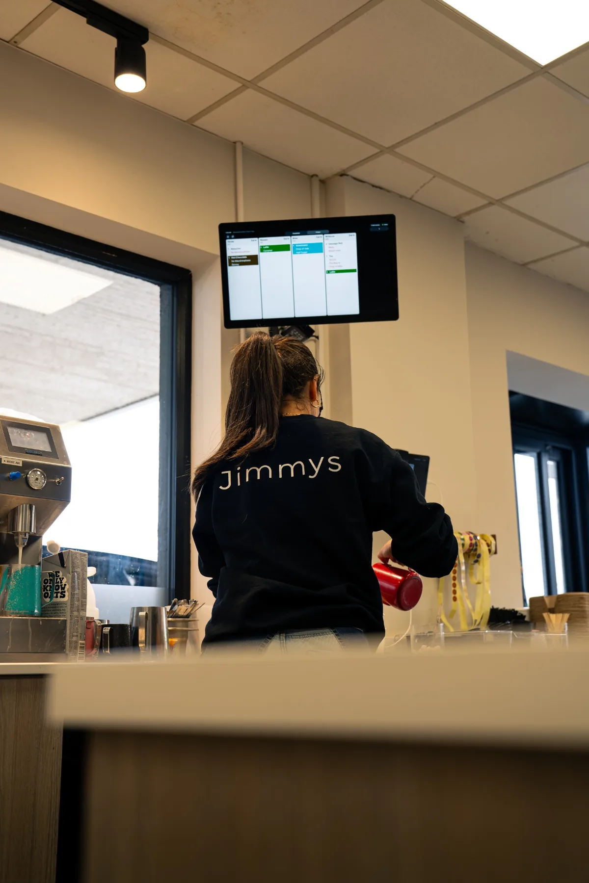Jimmys staff member working inside the Ballina coffee bar