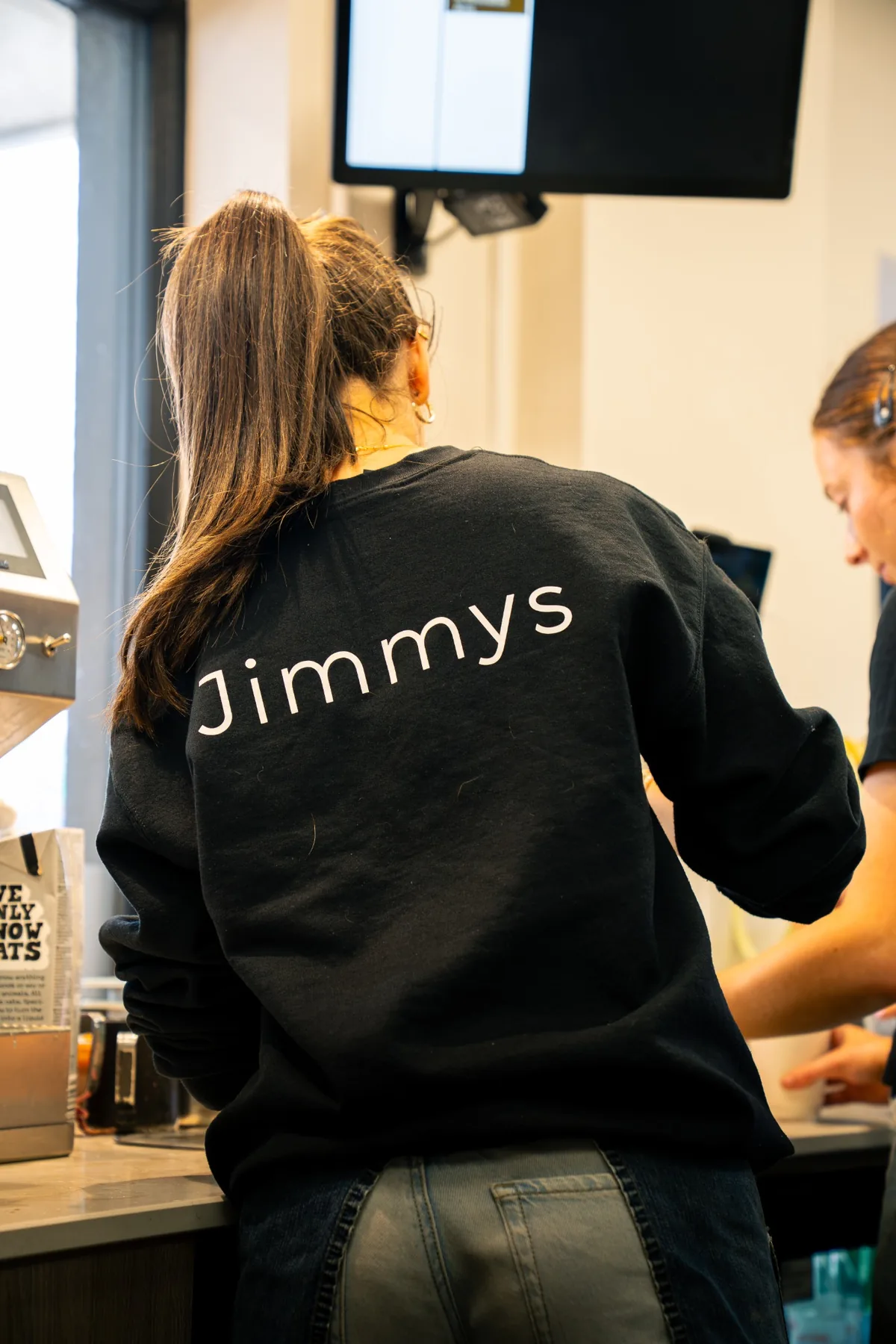 Jimmys staff branding photographed inside the coffee bar