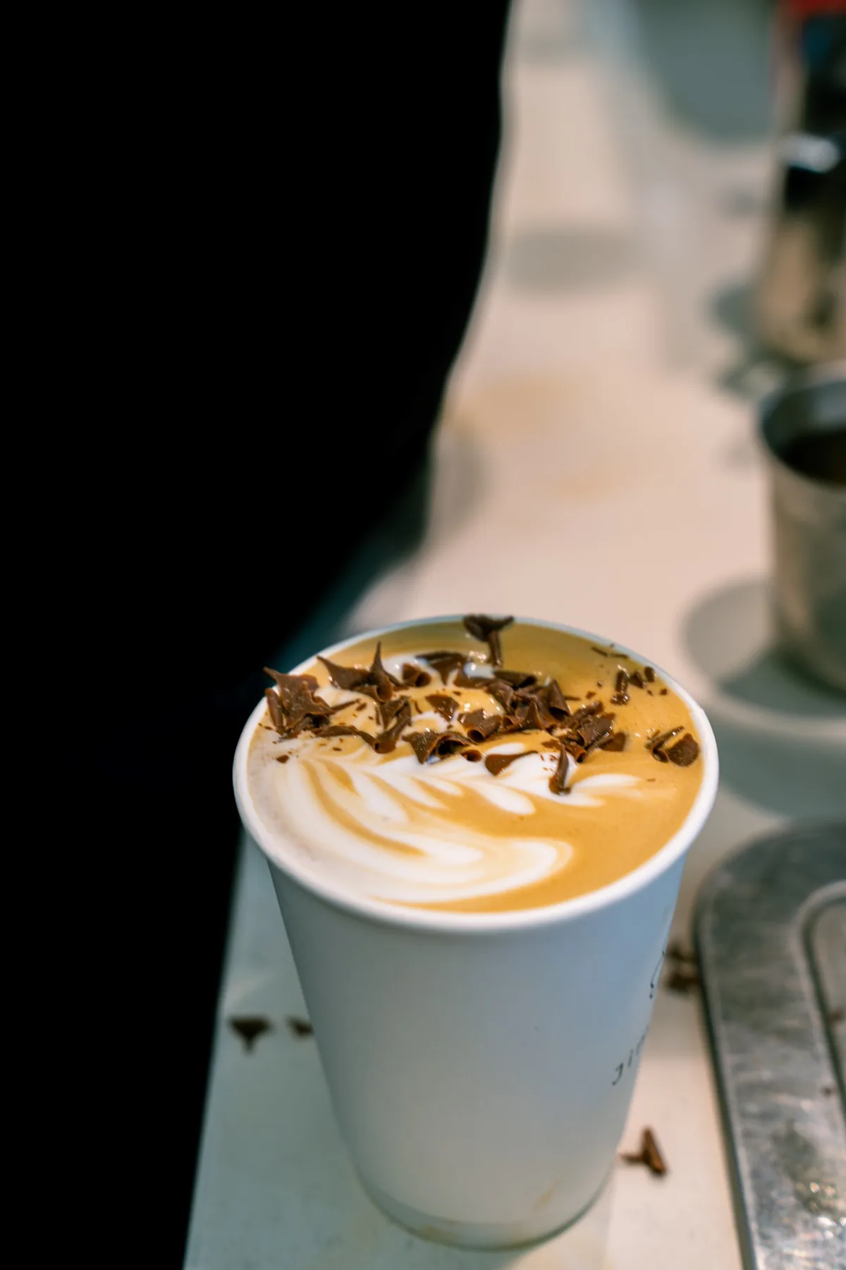 Finished specialty coffee with chocolate detail at Jimmys