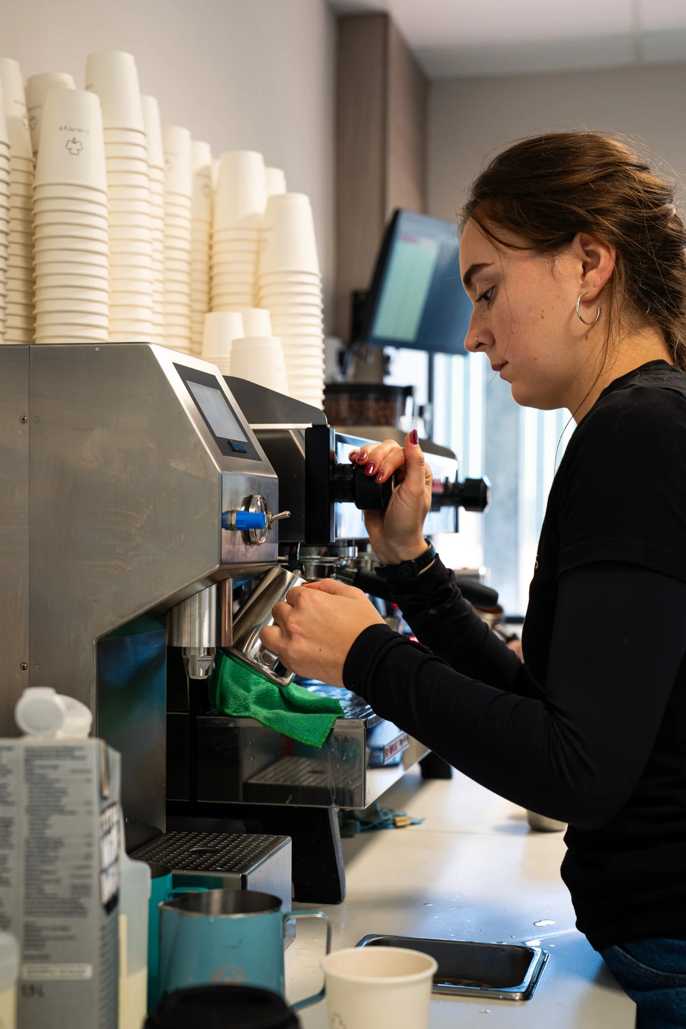 Barista working at the espresso machine inside Jimmy’s