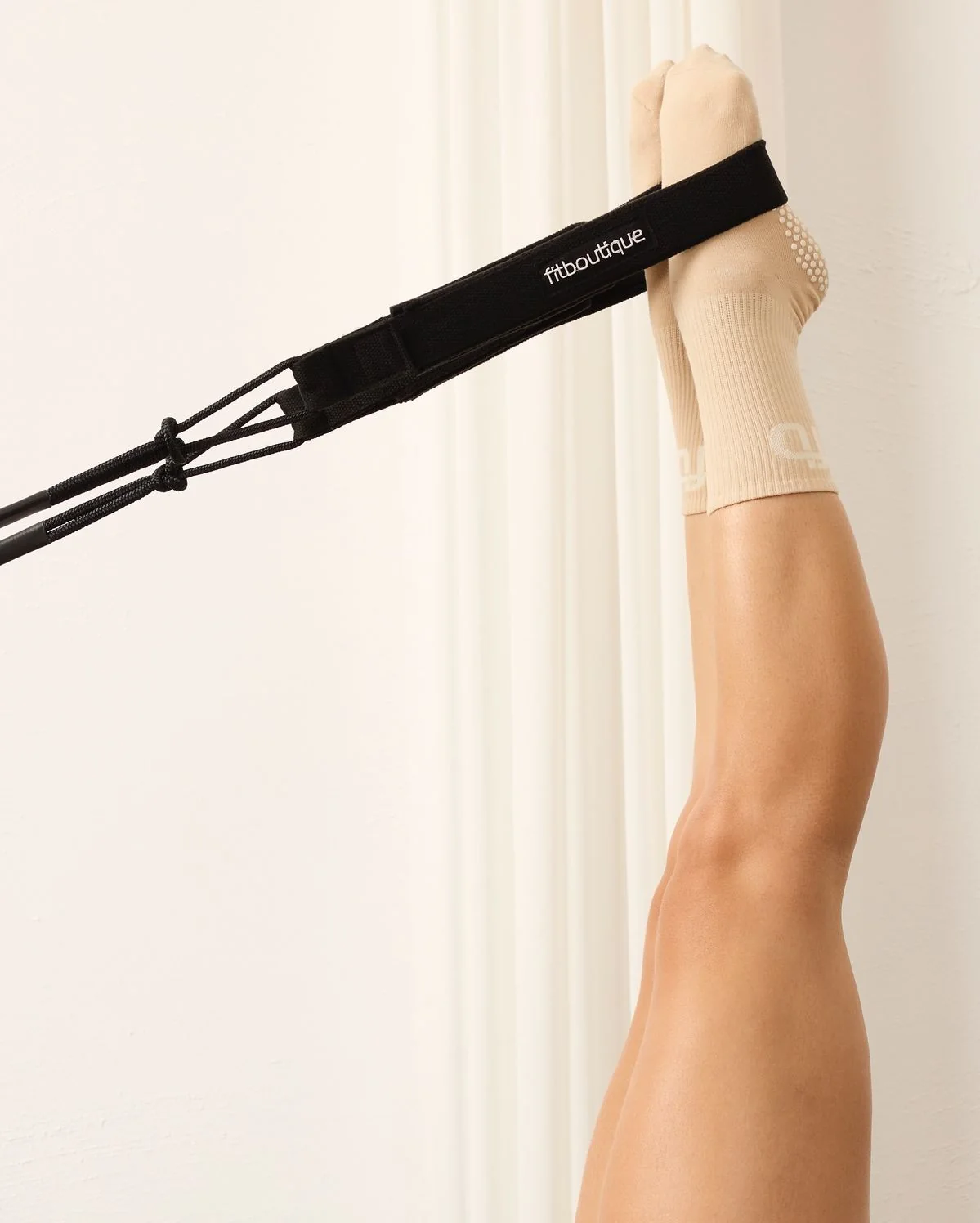 Pilates resistance strap and movement detail