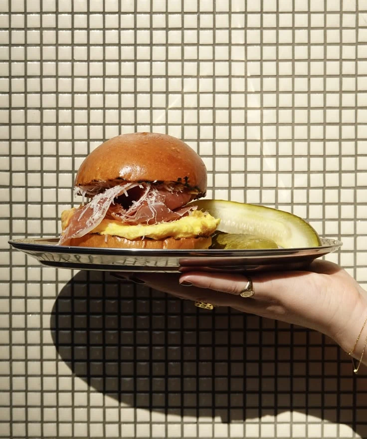Editorial food photograph of a sandwich served on a tray