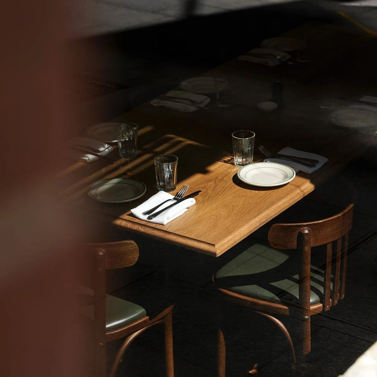 Restaurant table illuminated by afternoon sunlight
